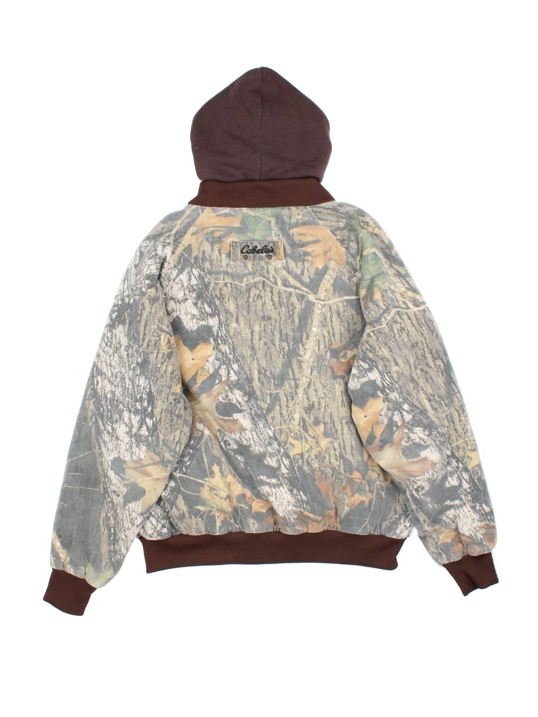 Vintage Cabela's Real Tree Camo Bomber Hunting Jacket in a greenand brown colourway. Zips and buttons up, has side pockets, insulated with a quilted lining, and hooded.