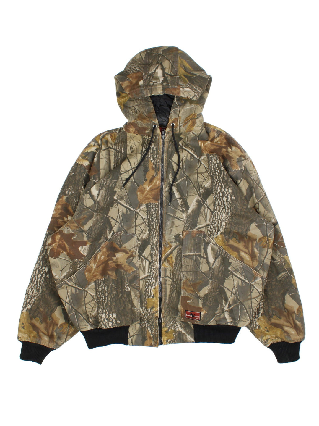 Vintage Black Duck Real Tree Camo Jacket in a green and brown patterned colourway. Zips up and has side pockets, insulated with a quilted lining, hooded, and has the logo embroidered on the front.