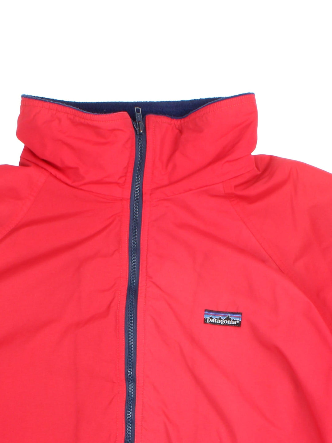 Vintage Patagonia Bomber Jacket in a red colourway. Zips up and has side pockets, insulated with a fleece lining, and has the logos embroidered on the front.