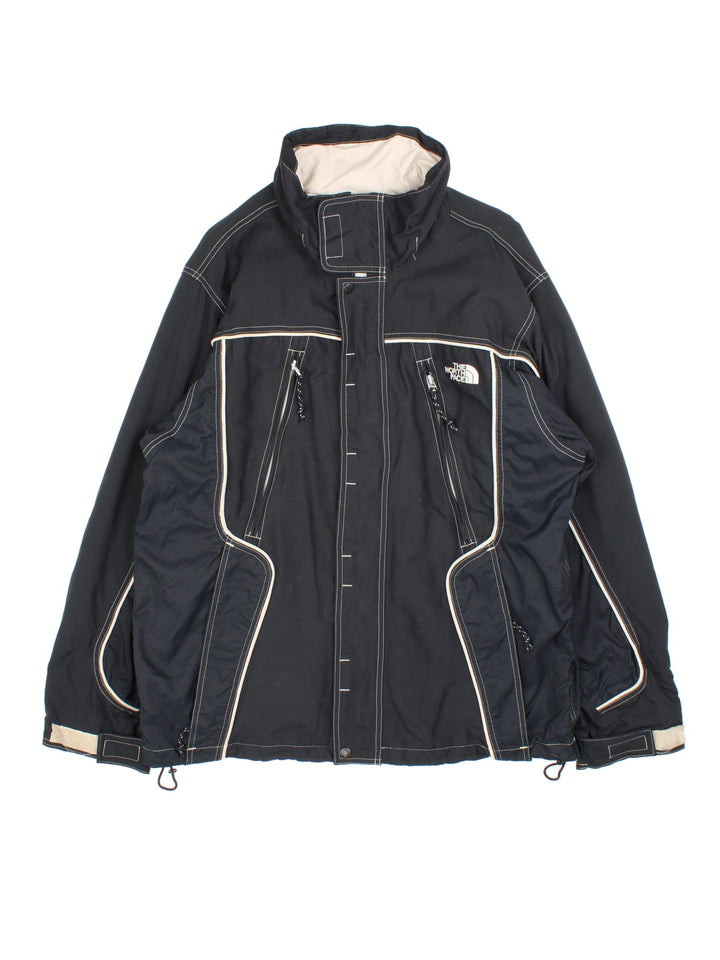 Vintage The North Face Jacket in a black colourway. Zips up and has side pockets, air vent zips on the front, and has the logo embroidered on the front and back.