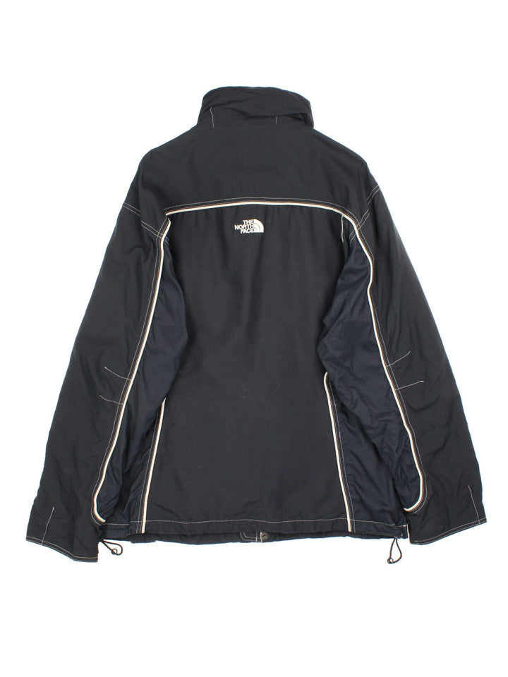 Vintage The North Face Jacket in a black colourway. Zips up and has side pockets, air vent zips on the front, and has the logo embroidered on the front and back.