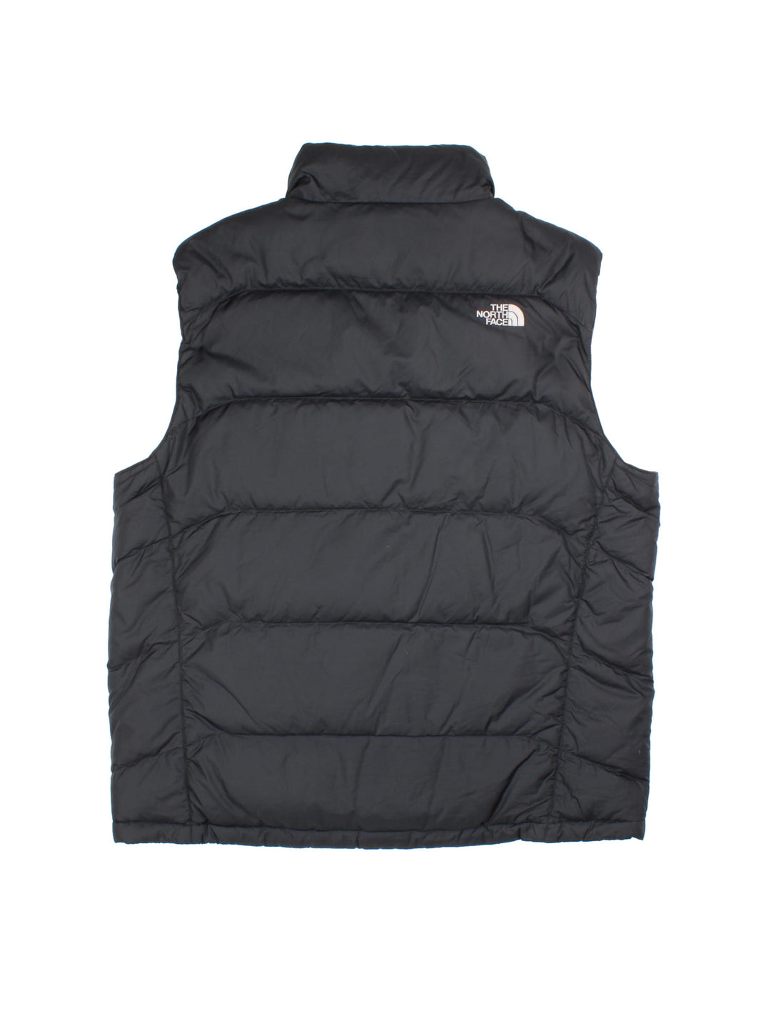 The North Face Nuptse Gilet in a black colourway. Zips up and has side pockets, insulated lining, and has the logo embroidered on the front and back.