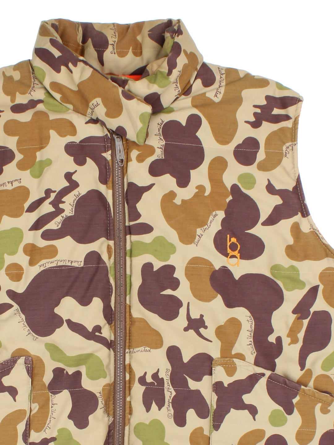 Vintage Reversible Camo Gilet Jacket in either a brown and green camo or orange colourway options. Zips up and has side pockets, insulated lining, and has a embroidered logo on the front.