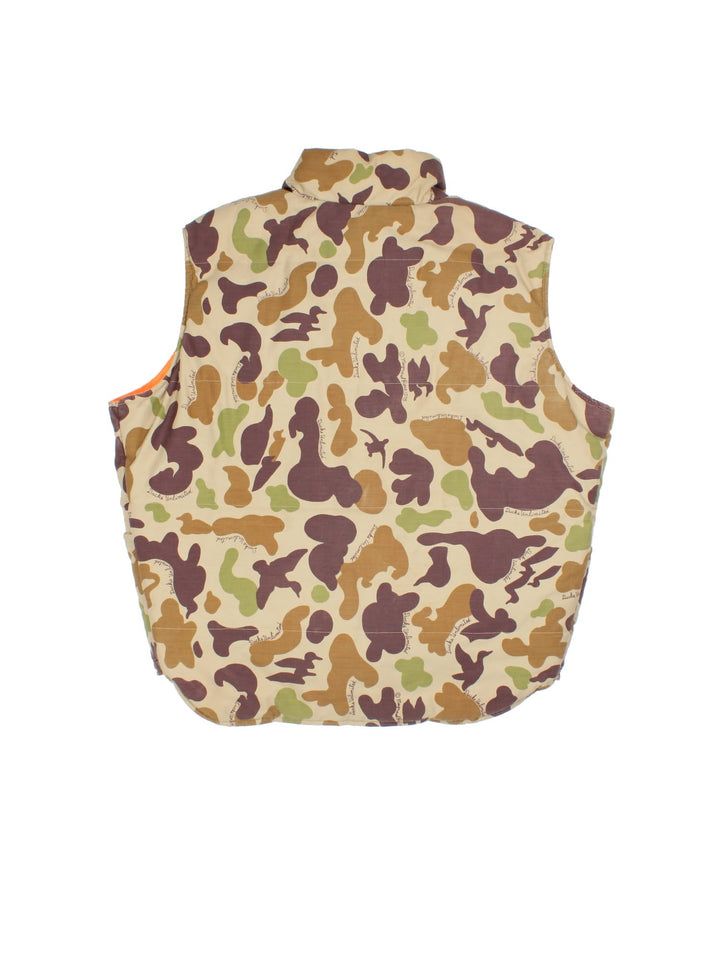 Vintage Reversible Camo Gilet Jacket in either a brown and green camo or orange colourway options. Zips up and has side pockets, insulated lining, and has a embroidered logo on the front.