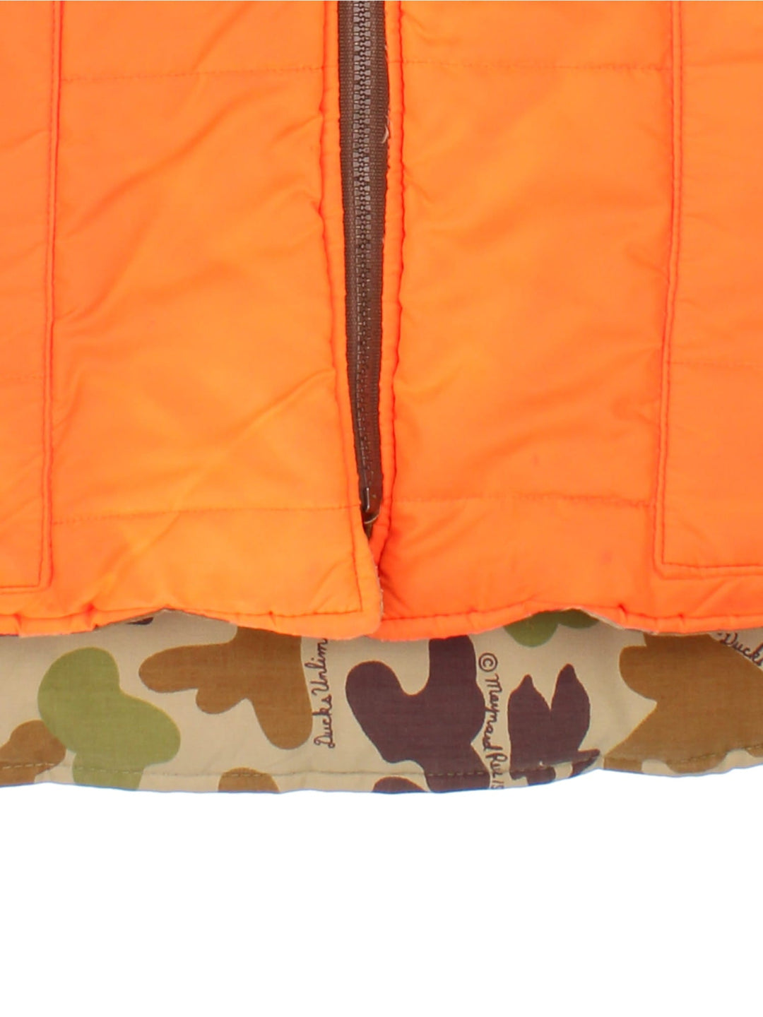 Vintage Reversible Camo Gilet Jacket in either a brown and green camo or orange colourway options. Zips up and has side pockets, insulated lining, and has a embroidered logo on the front.