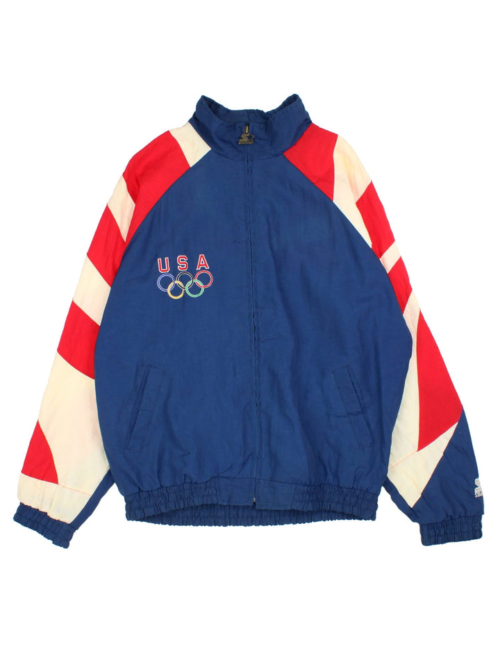 Vintage 1996 Team USA Starter Shell Jacket in a blue, white and red colourway. Zips up and has side pockets, USA and the olympics logo embroidered on the front, and big eagle graphic on the back.