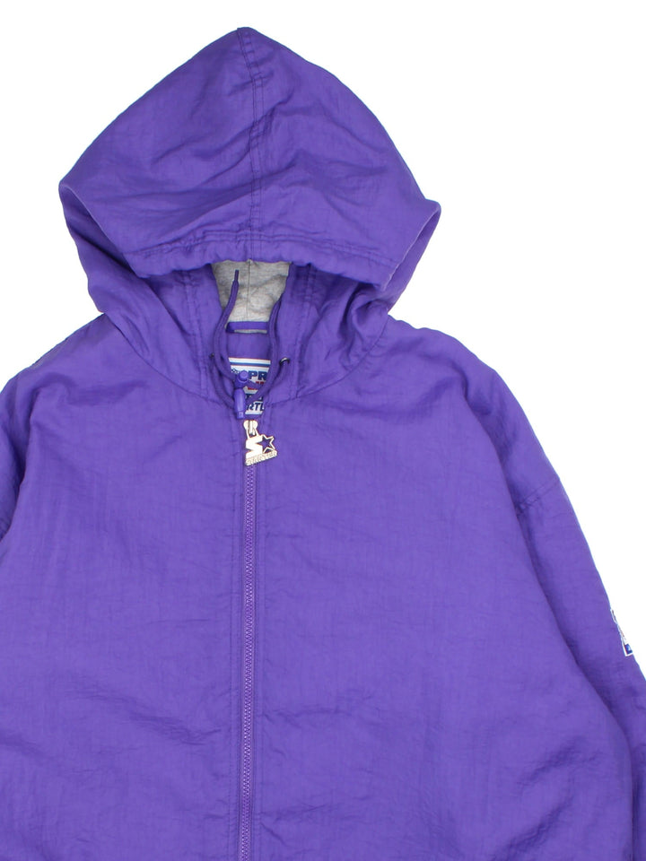 Vintage Starter Minnesota Vikings NFL Jacket in a purple colourway. Zips up and has side pockets, insulated with a quilted lining, and has the team logo embroidered on the front and back.