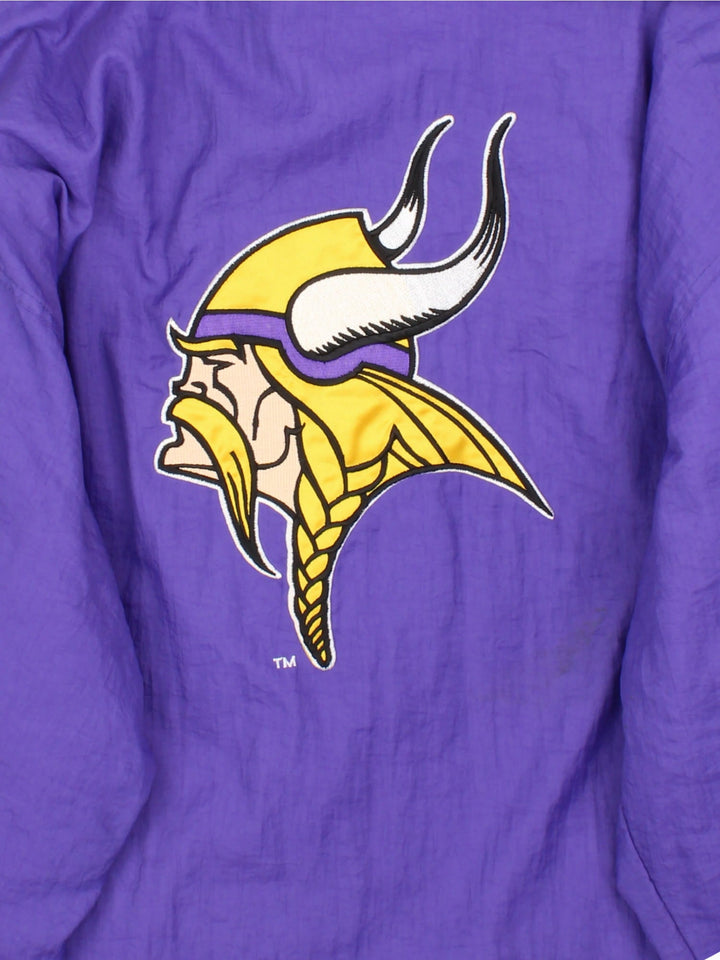 Vintage Starter Minnesota Vikings NFL Jacket in a purple colourway. Zips up and has side pockets, insulated with a quilted lining, and has the team logo embroidered on the front and back.