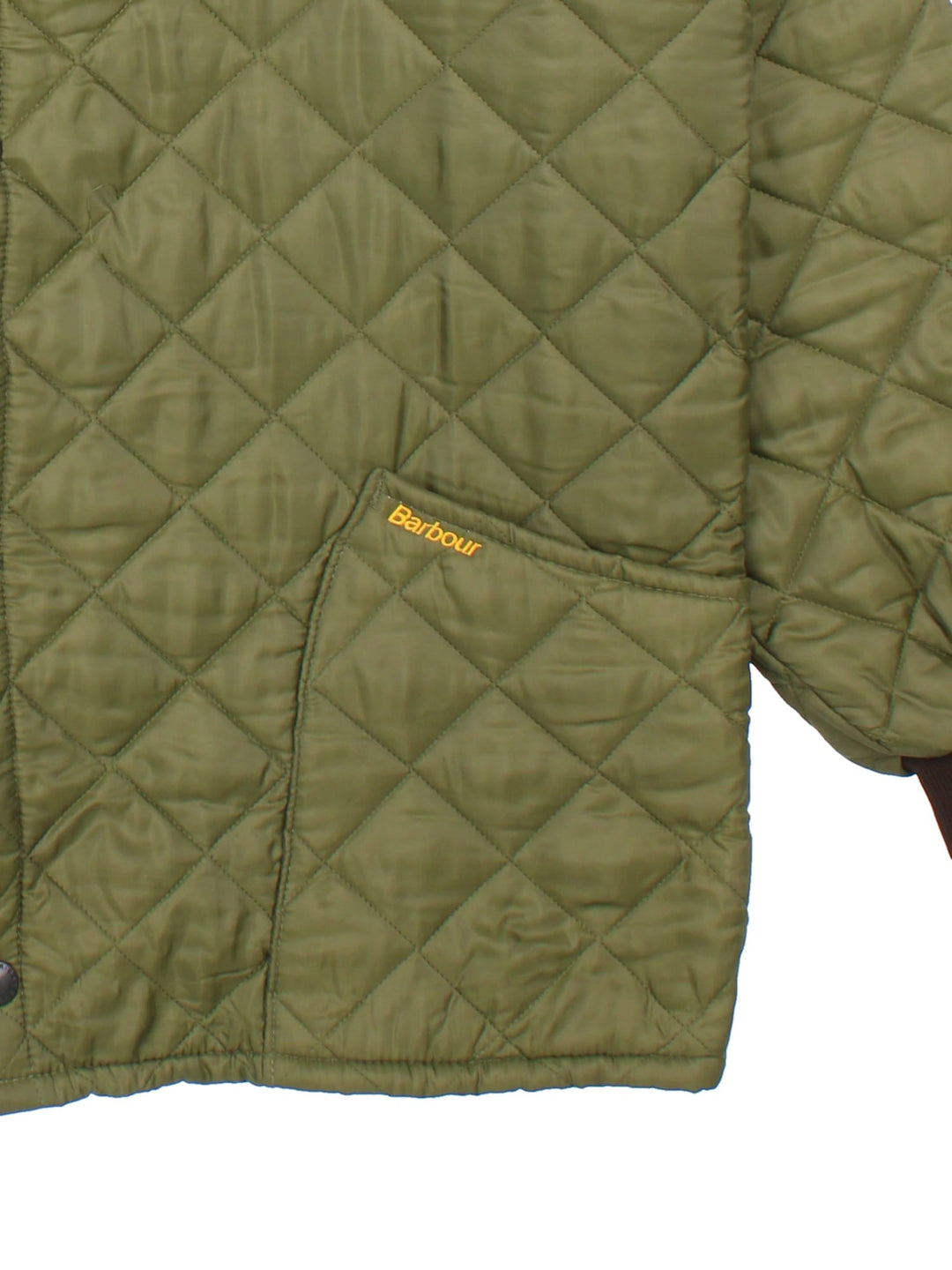 Vintage Barbour Coat in a green colourway, popper fastening with front pockets. All over quilting, and has logo embroidered on front pocket.