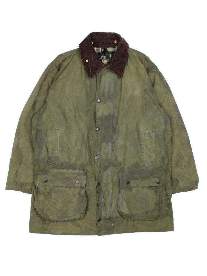 Vintage Barbour Boarder Wax Jacket in a green colourway, popper fastening with x4 front pockets. Contrast cord collar and signature checked lining.