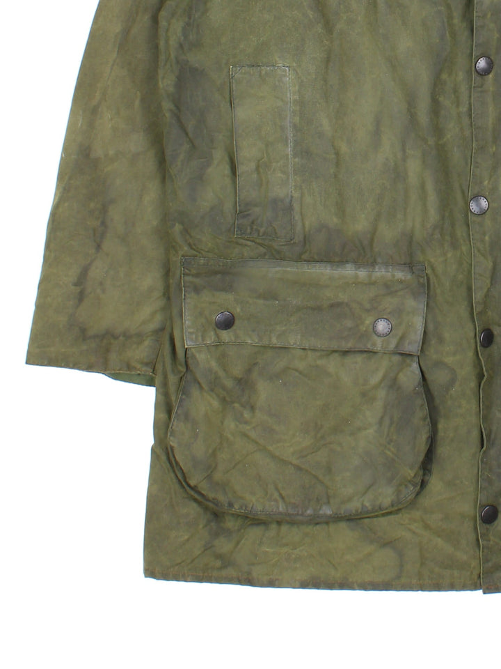 Vintage Barbour Boarder Wax Jacket in a green colourway, popper fastening with x4 front pockets. Contrast cord collar and signature checked lining.