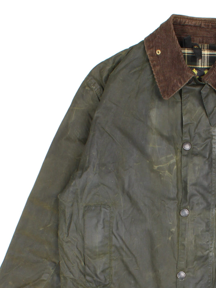 Vintage Barbour Border Wax Jacket in a green colourway, popper fastening with x4 front pockets. Contrast cord collar and checkered lining and branded badge.