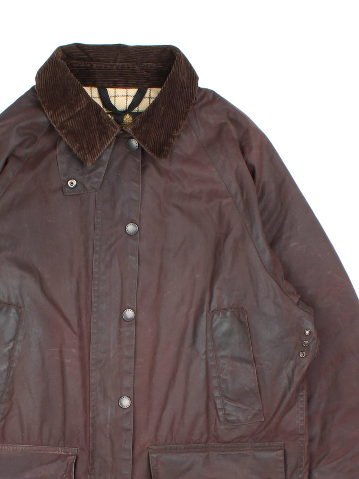 Vintage Barbour Beadle Wax Jacket in a brown colourway, zip/popper fastening with x4 front pockets. Contrast cord collar, checked lining and branding on front left pocket.