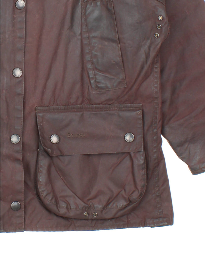 Vintage Barbour Beadle Wax Jacket in a brown colourway, zip/popper fastening with x4 front pockets. Contrast cord collar, checked lining and branding on front left pocket.