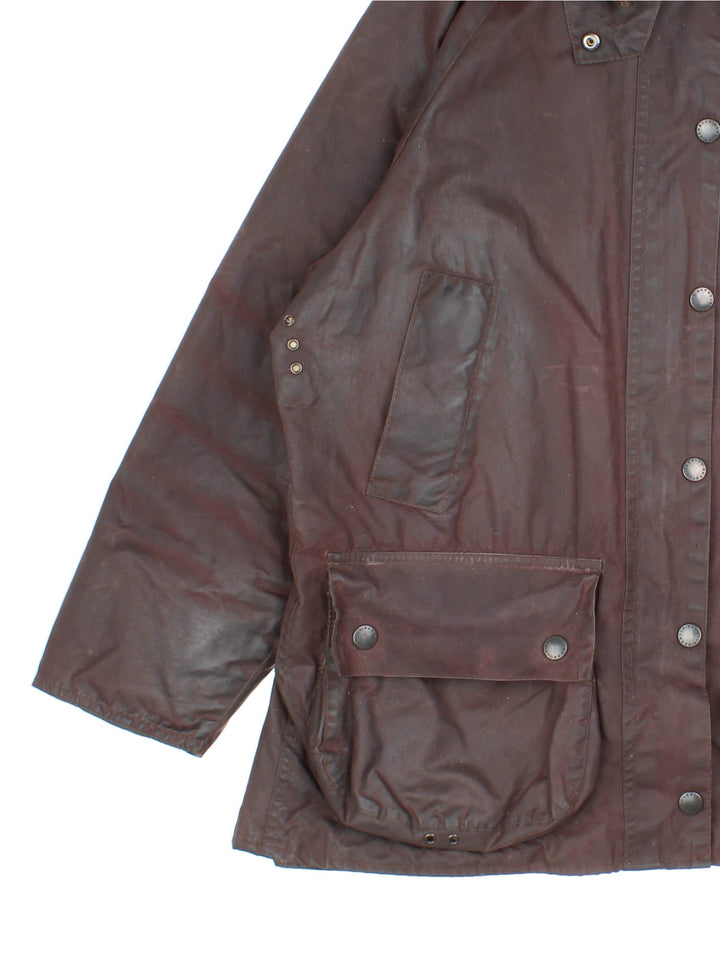 Vintage Barbour Beadle Wax Jacket in a brown colourway, zip/popper fastening with x4 front pockets. Contrast cord collar, checked lining and branding on front left pocket.