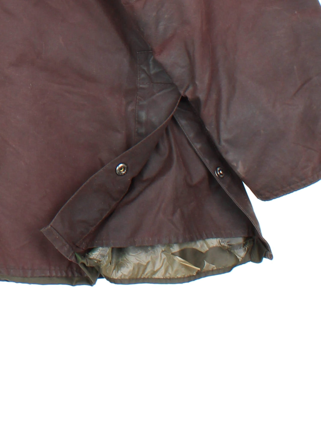 Vintage Barbour Beadle Wax Jacket in a brown colourway, zip/popper fastening with x4 front pockets. Contrast cord collar, checked lining and branding on front left pocket.