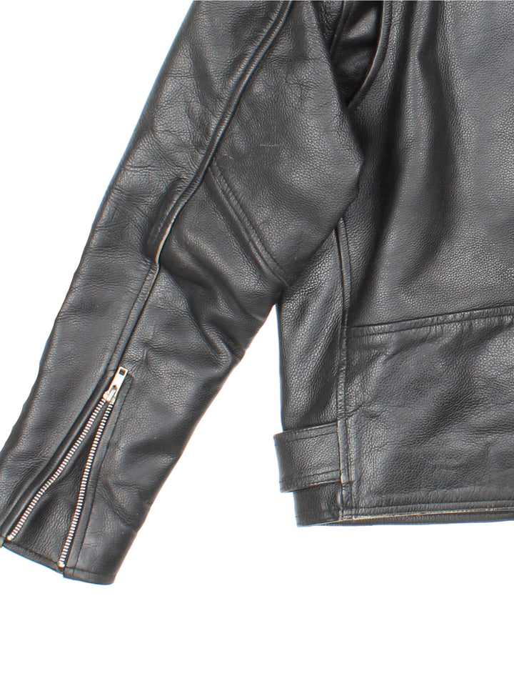 Vintage Avia Trix Leather Biker Jacket in black features zip up pockets, motorcycle detailing and buckle details on the hips.