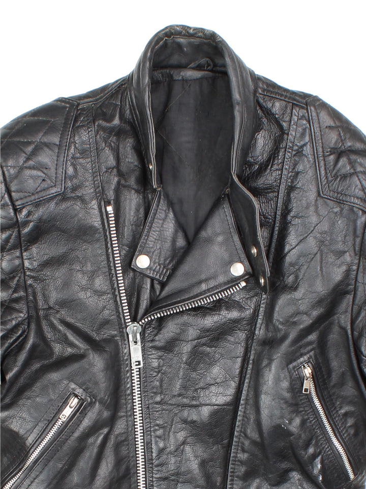 Vintage Leather Biker Jacket in black features zip up pockets, motorcycle detailing, quilted patches and buckle details on the hips.