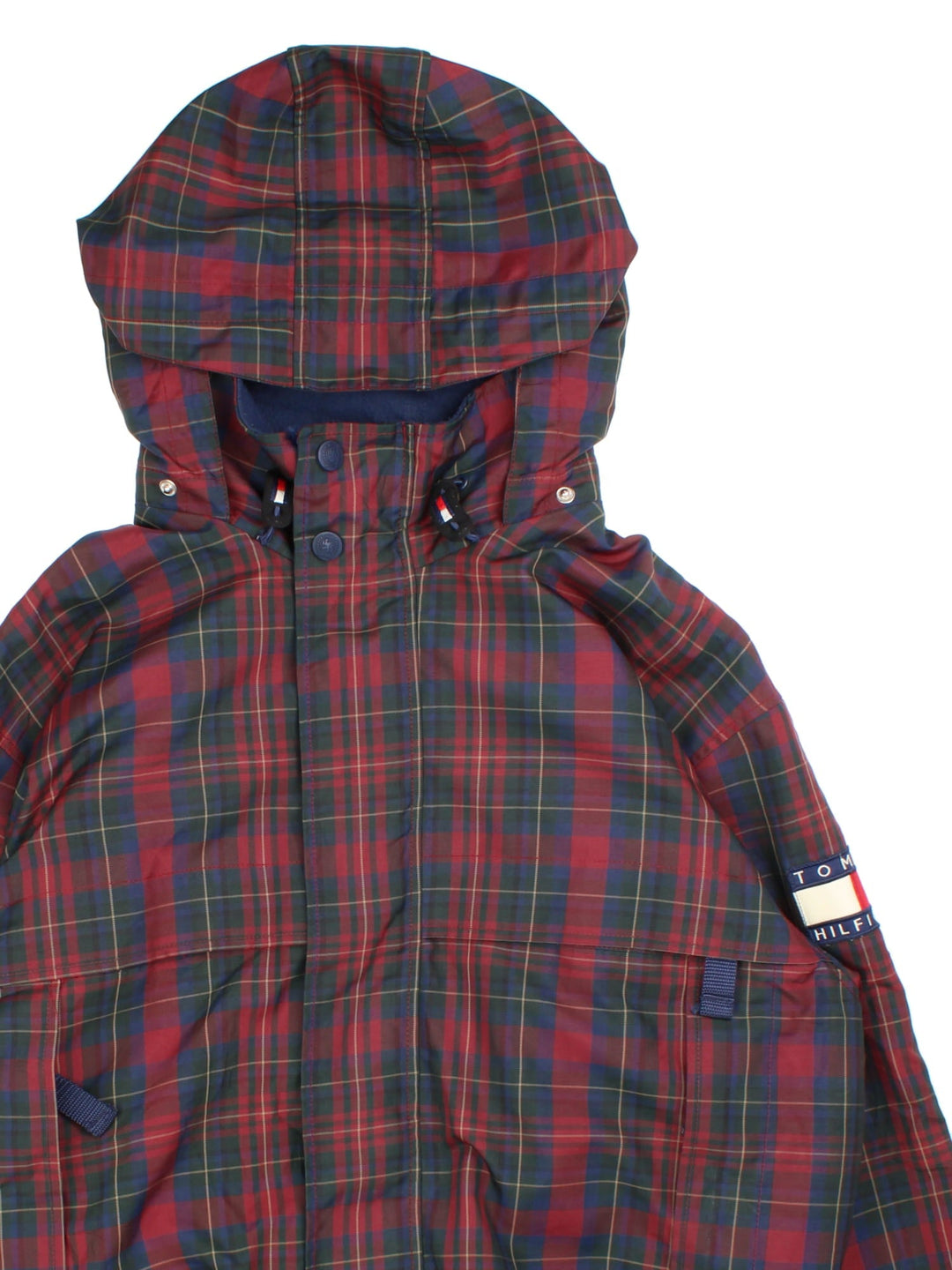 Vintage 90's Tommy Hilfiger Tartan Jacket in a red tartan patterned colourway. Zips up and has multiple pockets, insulated with a fleece lining, and has the logo embroidered on the left sleeve and on the back.