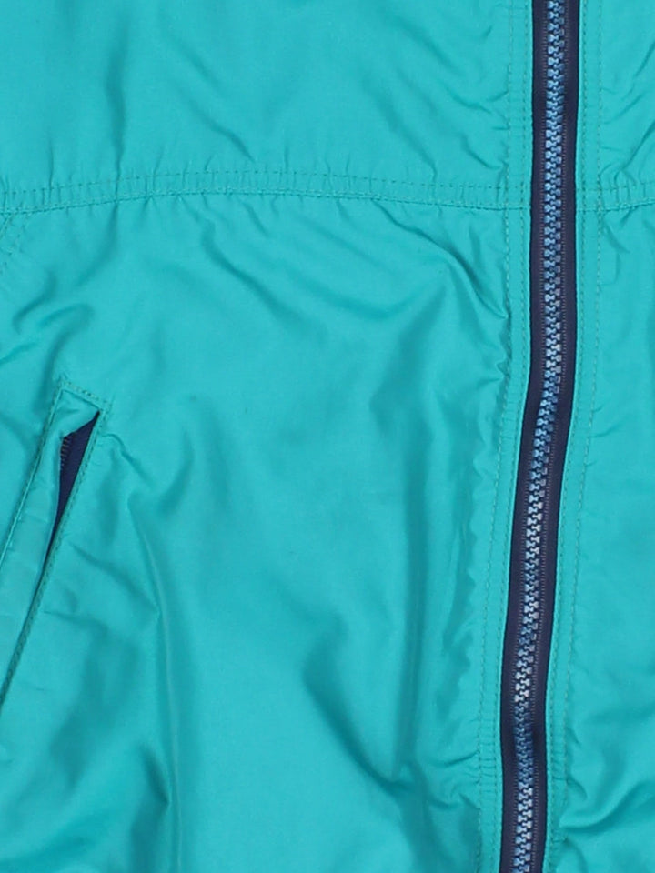 Vintage 90's Patagonia Bomber Jacket in a turquoise blue colourway. Zips up and has side pockets, insulated with a fleece lining, and has the logo embroidered on the front.