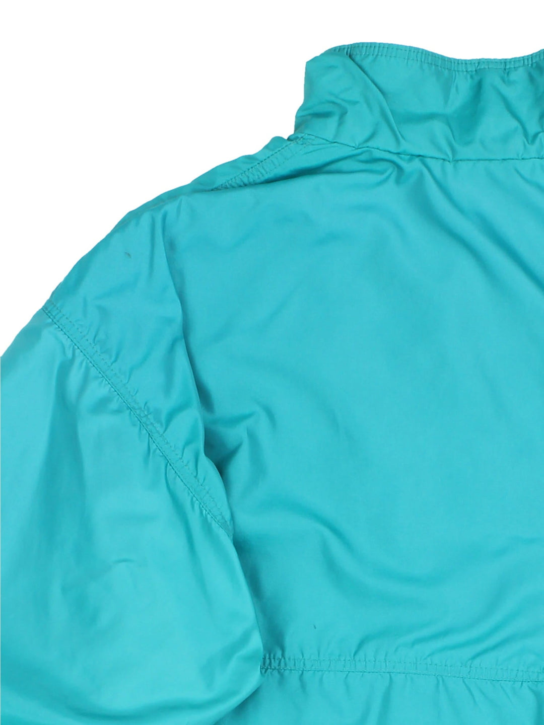 Vintage 90's Patagonia Bomber Jacket in a turquoise blue colourway. Zips up and has side pockets, insulated with a fleece lining, and has the logo embroidered on the front.