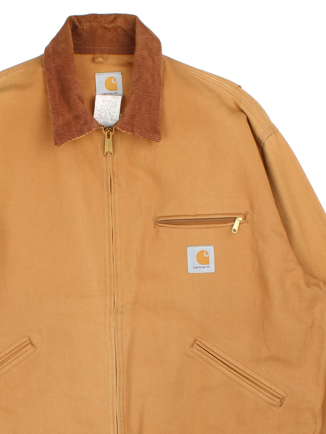 Carhartt Detroit Jacket in a tan colourway. Full zip with multiple pockets on the front. Suede collar, button cuffs and small classic logo on the front.