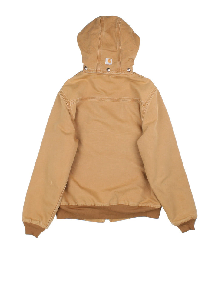 Carhartt Hooded Jacket in a brown colourway. Full zip with sherpa lining and multiple pockets on the front. Detachable hood, cuffed hem and sleeves, and has small classic logo on the front.