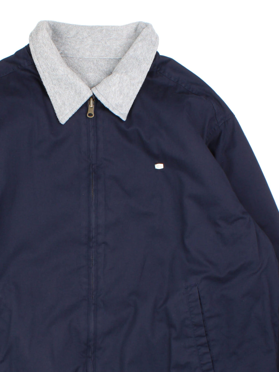 Lacoste Reversible Bomber Jacket in a blue and grey colourway with either jacket or fleece reversible options. Zips up and has side pockets, insulated lining, and has the logo embroidered on the front.