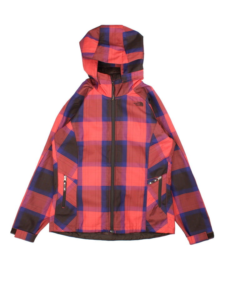 The North Face Plaid Jacket in a red, blue and black patterned colourway. Zips up and has side pockets, insulated with a fleece lining, hooded and has the logo embroidered on the front and back.