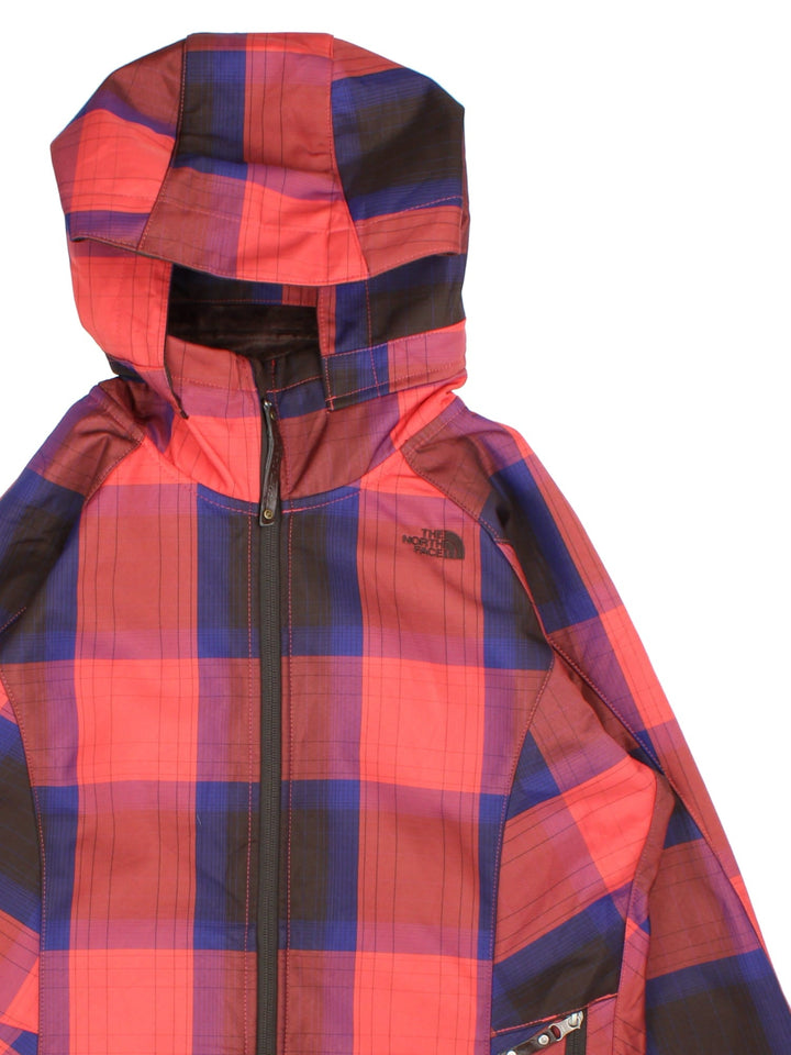 The North Face Plaid Jacket in a red, blue and black patterned colourway. Zips up and has side pockets, insulated with a fleece lining, hooded and has the logo embroidered on the front and back.