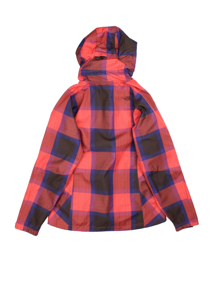 The North Face Plaid Jacket in a red, blue and black patterned colourway. Zips up and has side pockets, insulated with a fleece lining, hooded and has the logo embroidered on the front and back.