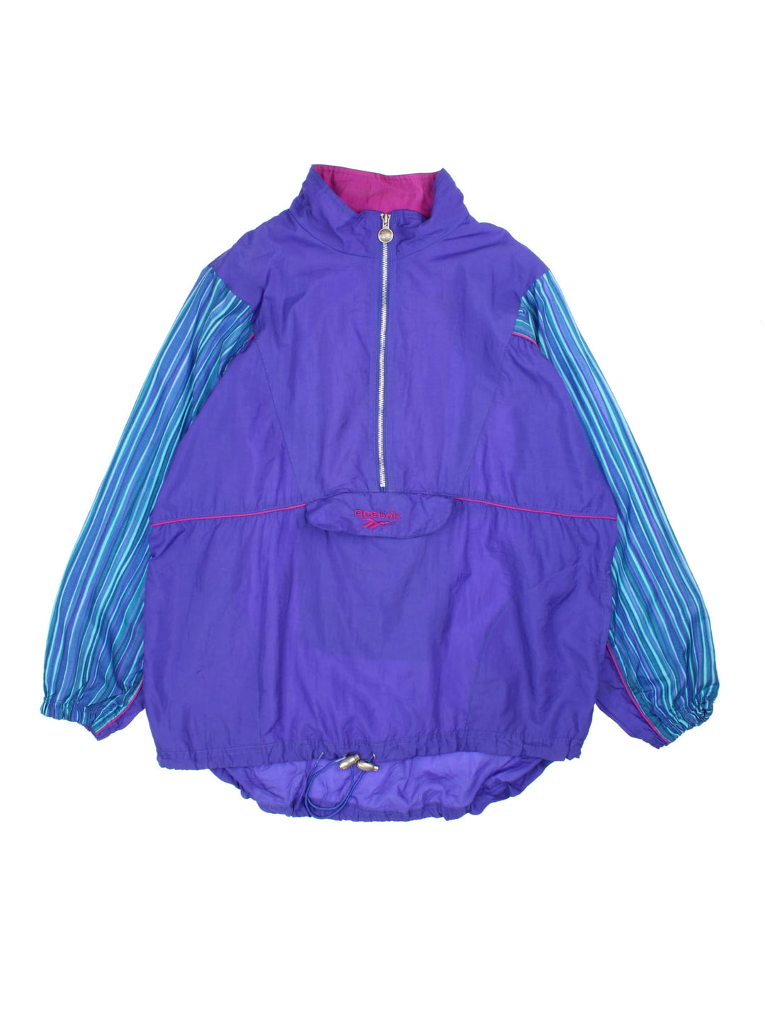 Vintage 90's Reebok Pullover Windbreaker in a purple and blue colourway. Half zip up and has multiple pockets, and the spell out logo embroidered on the front.