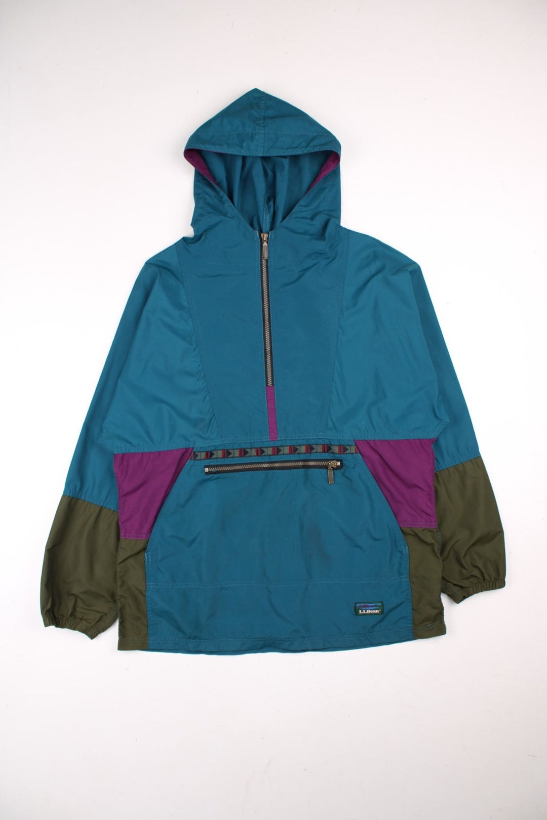 Vintage L.L Bean Lightweight Aztec Anorak Jacket in a blue, green and purple colourway. Half zips up and has pouch pockets, Aztec patterns embroidered on the front, hooded and has the logo embroidered on the front.