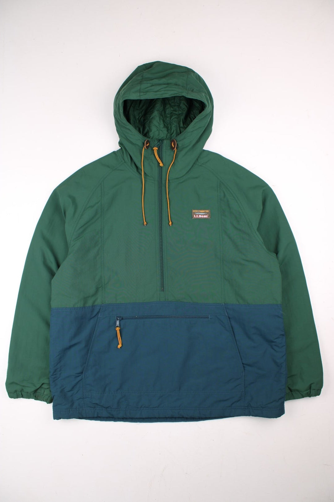 L.L Bean Mountain Classic Anorak Jacket in a green and blue colourway. Half zips up and has pouch pockets, insulated with a quilted lining, hooded, and has the logo embroidered on the front.