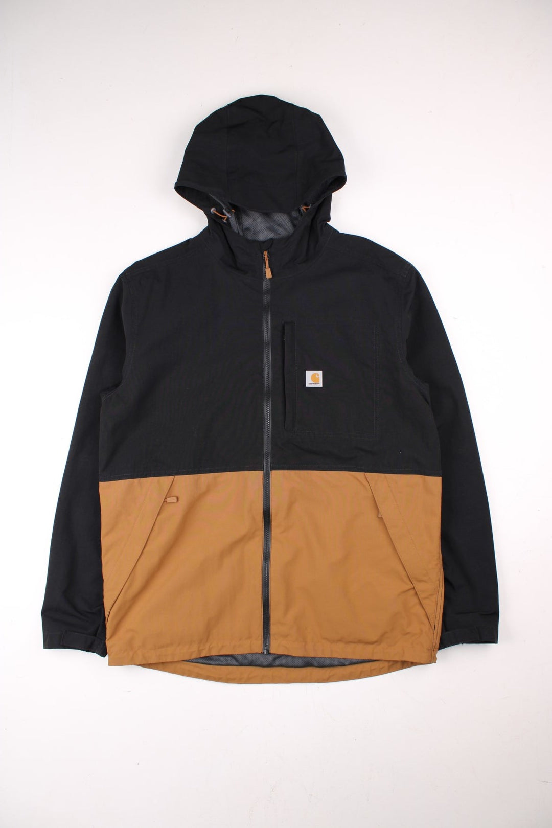 Carhartt Storm Defender Jacket in a black and brown colourway. Zips up and has multiple pockets, mesh lining, hooded and has the logo embroidered on the front.