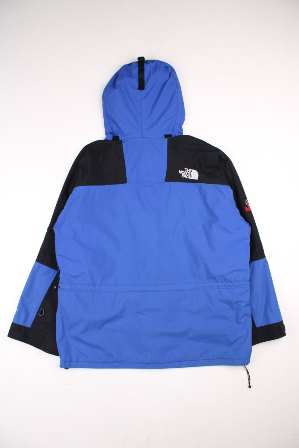 Vintage The North Face Gore-Tex Summit Series Jacket in a blue and black colourway. Zip and buttons up, has multiple pockets, mesh lining, hooded, and the logo embroidered on the front and back.