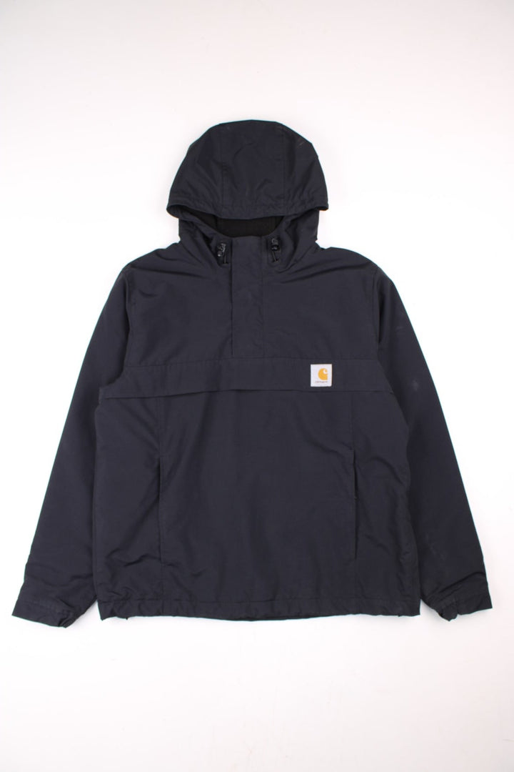 Carhartt Nimbus Pullover Jacket in a black colourway. Quarter zip up and has a pouch pocket, insulated with a fleece lining, hooded, and has the logo embroidered on the front.