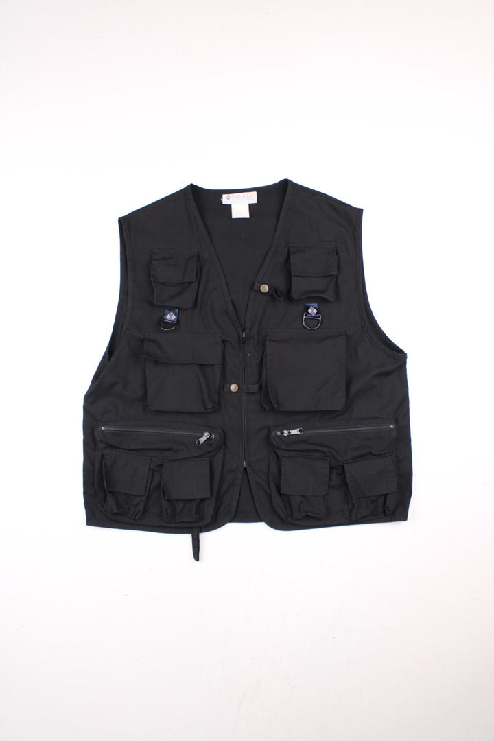 Vintage Columbia PFG Fishing Vest Gilet in a black colourway. Zips up and has multiple utility pockets, and has the logo embroidered on the back.