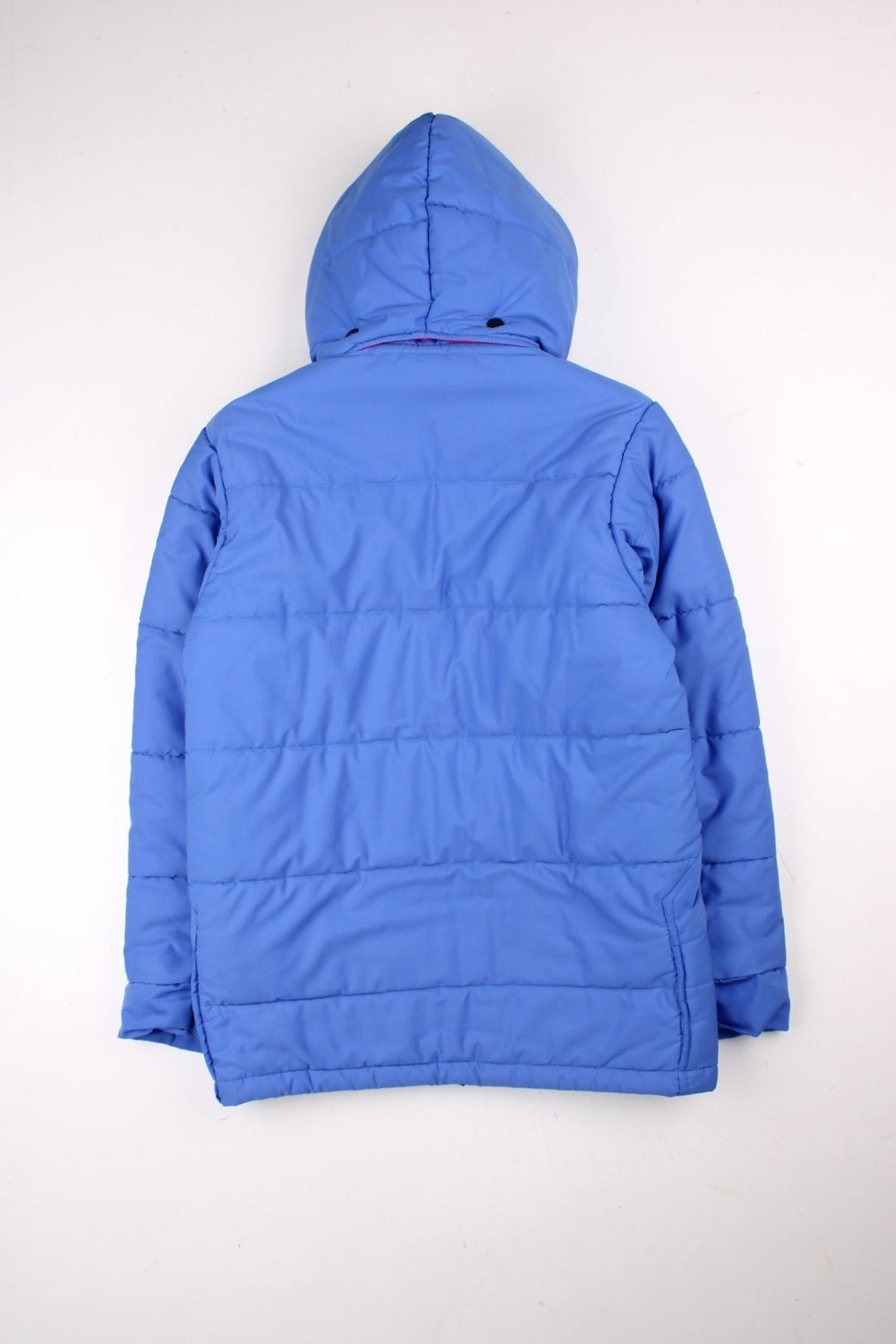 Vintage Berghaus Ice Cap Pole Puffer Jacket in a blue and pink colourway. Zip and buttons up, has side pockets, detachable hood, insulated, and has the logo embroidered on the front.