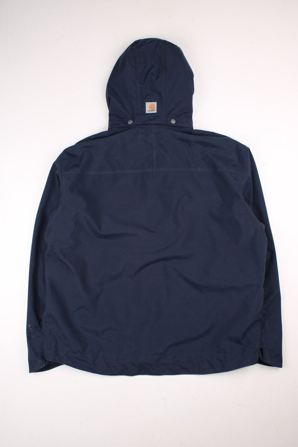 Carhartt Shoreline Jacket in a navy blue colourway. Zips up and has multiple pockets, detachable hood, mesh lining, and has the logo embroidered on the front.