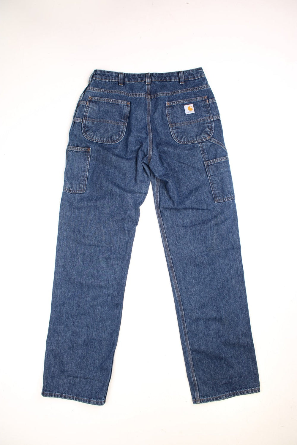  Carpenter Jeans in a dark  colourway, has multiple pockets and the logo embroidered on the back.