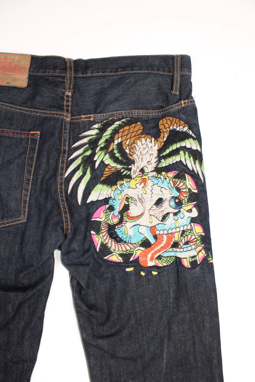 Y2K  Jeans in a  colourway with embroidered skull & eagle on the back and has multiple pockets.