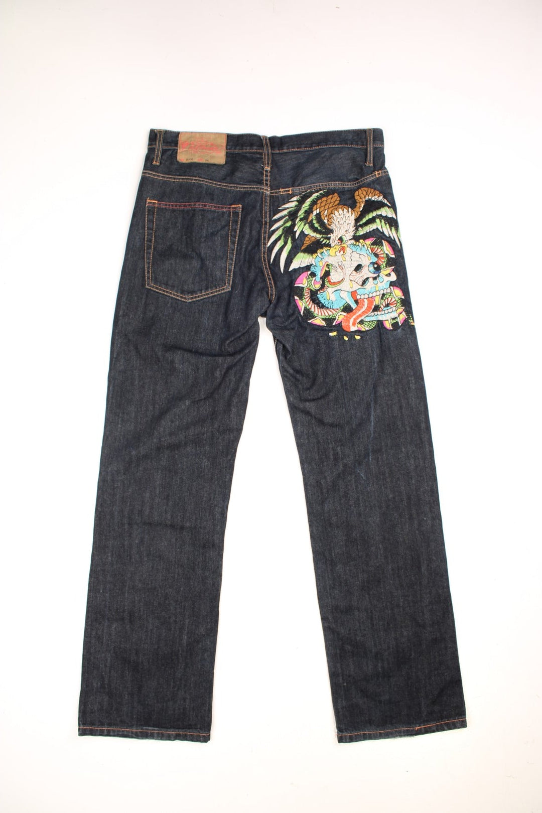 Y2K Ed Hardy Jeans in a black colourway with embroidered skull & eagle on the back and has multiple pockets.