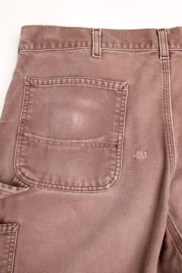  Carpenter Jeans in a  colourway, has multiple pockets and the logo embroidered on the back.