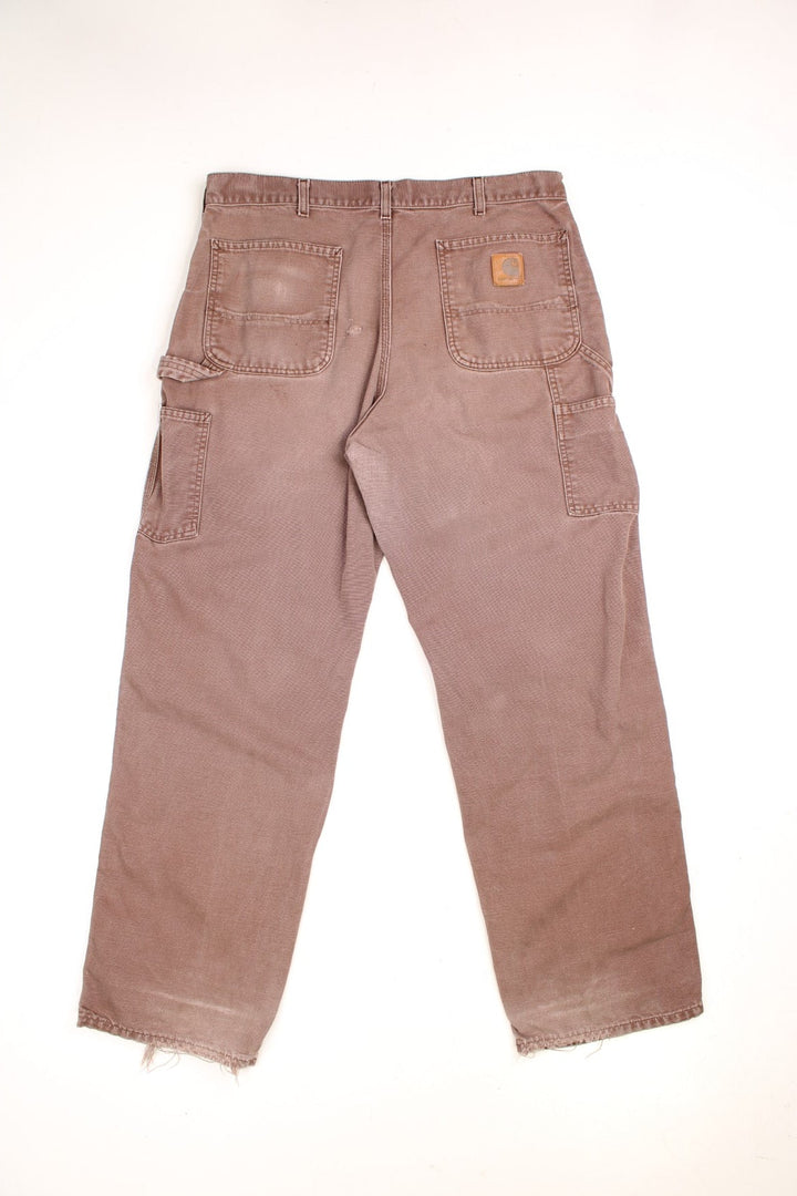  Carpenter Jeans in a  colourway, has multiple pockets and the logo embroidered on the back.