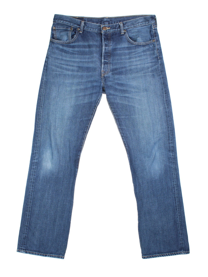 Levi Strauss 501 Jeans in blue colourway with multiple pockets and the logo tab embroidered on the back.