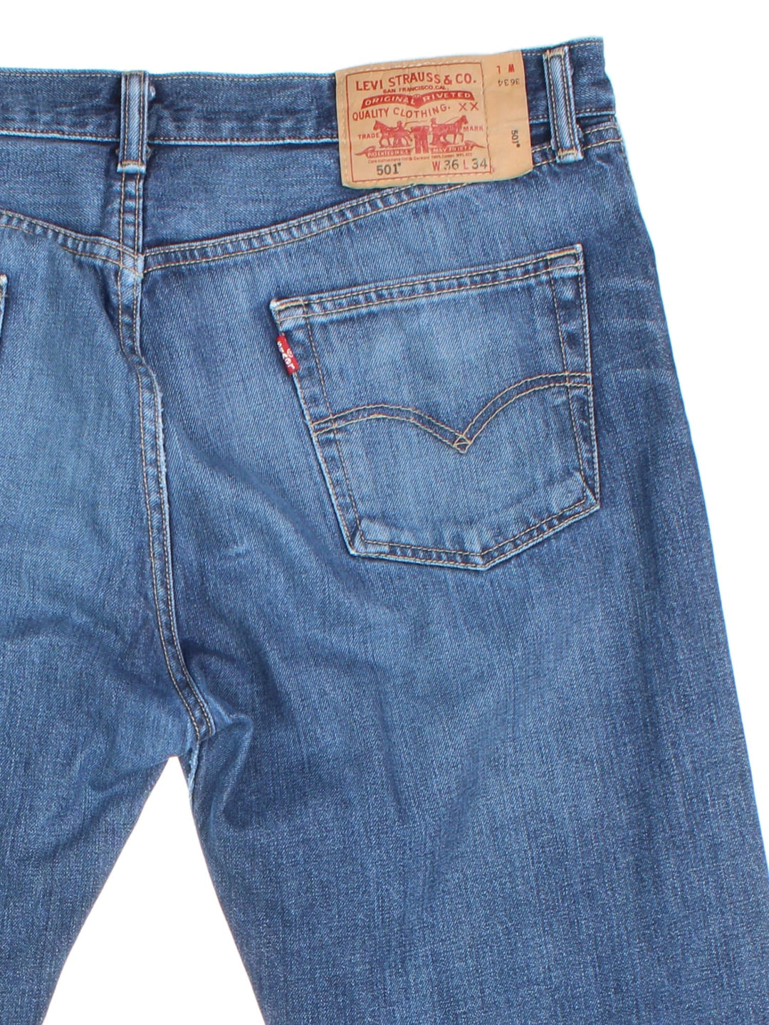 Levi Strauss 501 Jeans in blue colourway with multiple pockets and the logo tab embroidered on the back.