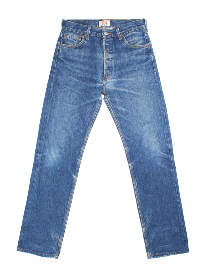 Levi Strauss 501 Jeans in blue colourway with multiple pockets and the logo tab embroidered on the back.