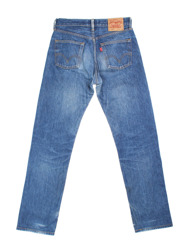 Levi Strauss 501 Jeans in blue colourway with multiple pockets and the logo tab embroidered on the back.