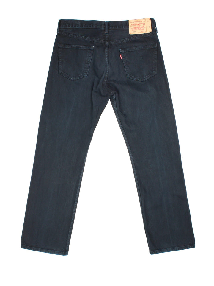 Levi Strauss 501 Jeans in black colourway with multiple pockets and the logo tab embroidered on the back.